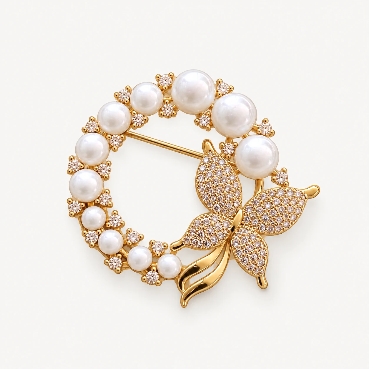 Garland Butterfly brooch with a ring of pearls and a butterfly motif.