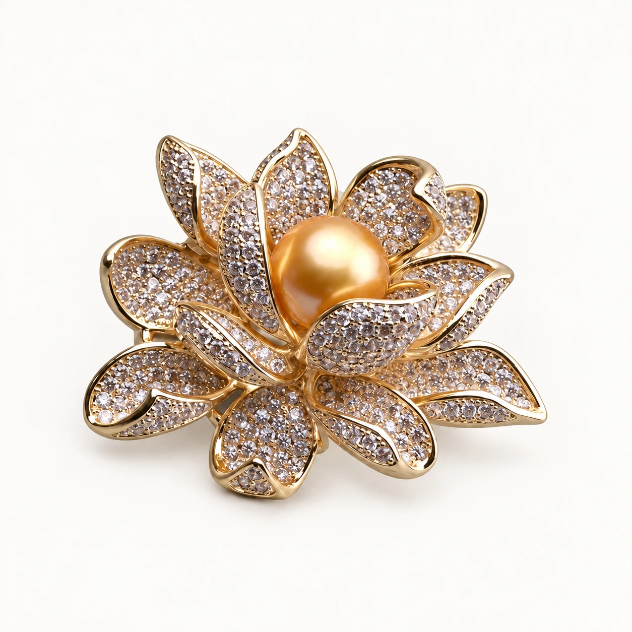 Golden Lotus brooch with a golden pearl surrounded by sculptural petals.
